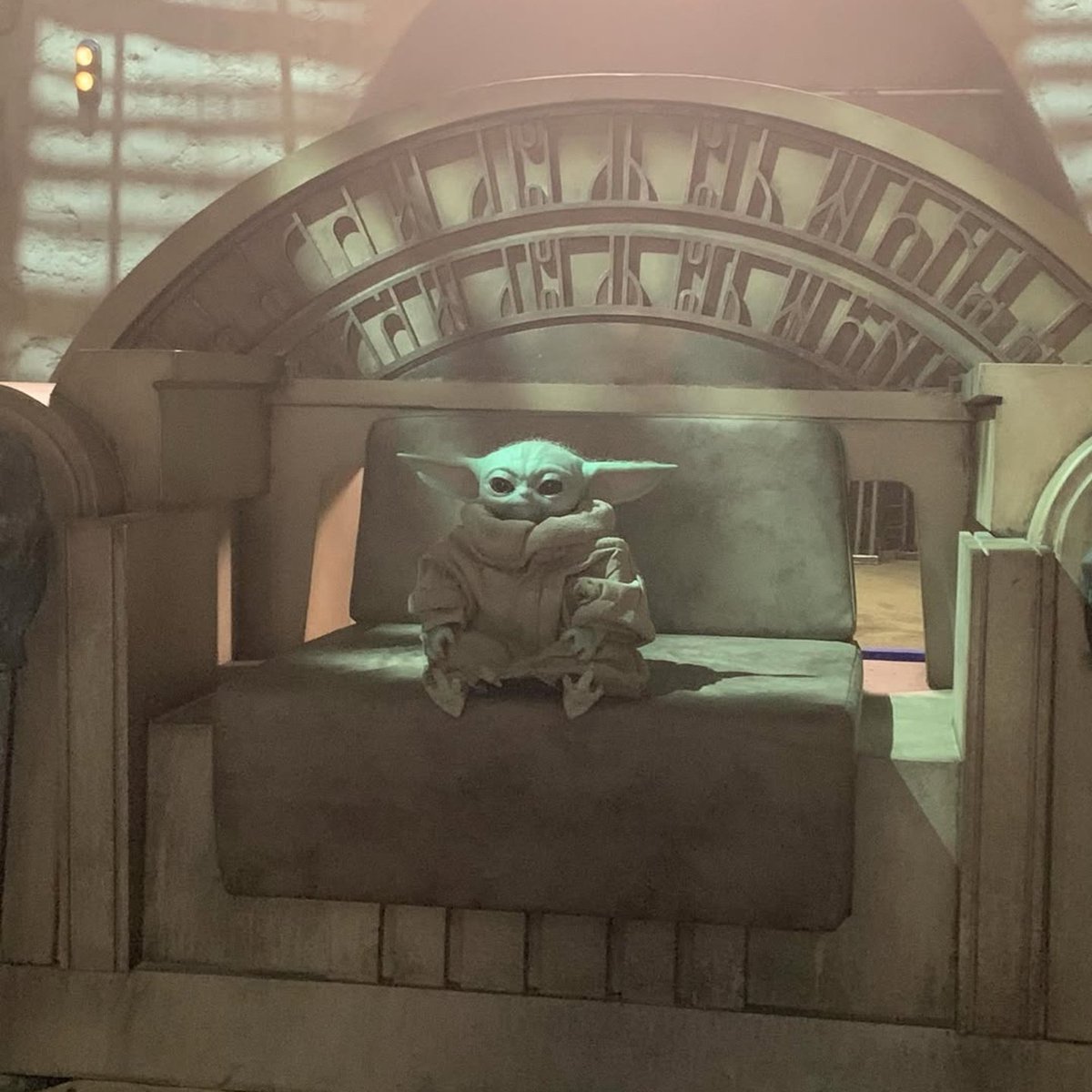 notsihas's tweet photo. obsessed with this picture of grogu. why does it look like he's royalty chilling on his throne. also why does he have chicken feet https://t.co/4QDs8lhaOK