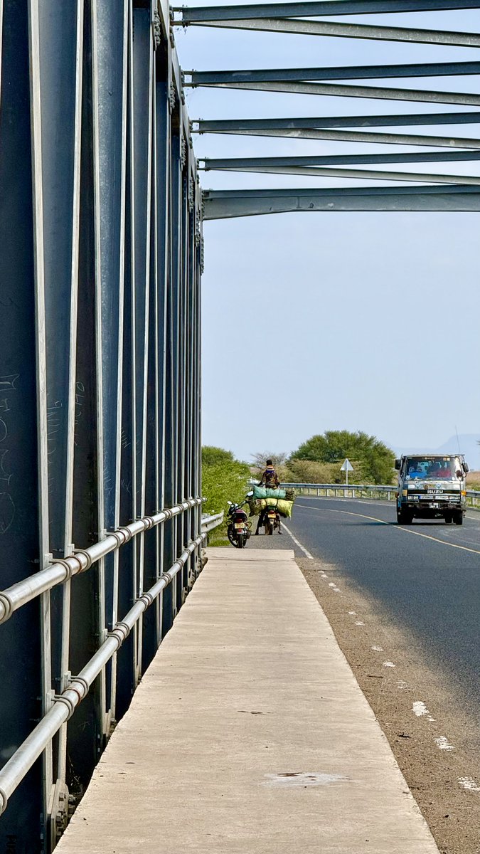 ZeddyBariti's tweet photo. The biggest road surprise in Kenya isn't in Nairobi.
It is the drive from Kitale to Nadapal, on the South Sudan border. A route once defined by insecurity, breakdowns and impassable roads is now over 500 kms of uninterrupted smooth tarmac through Kenya's largest county. Most Kenyans still think of Turkana as remote but it now offers one of the country's most spectacular long-distance highway drives. 
Kalobeyei Bridge is simply the moment you realize the old map in your mind is no longer accurate.