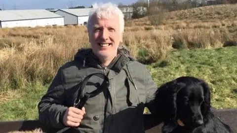 TheMercianNews's tweet photo. 🚨NEW: A 55-year-old man died after twice calling 999, only to be told by call handlers an ambulance would not be sent for him and was instead told to wait for a callback.

Brian Hurton had an aortic dissection, when a tear opens up in the body's main artery, and told call handlers that he was losing his breath.

An hour and 12 minutes after his first call a clinician called him back, but it was too late.

An ambulance was not dispatched until 3 hours and 30 minutes after his first call to 999.