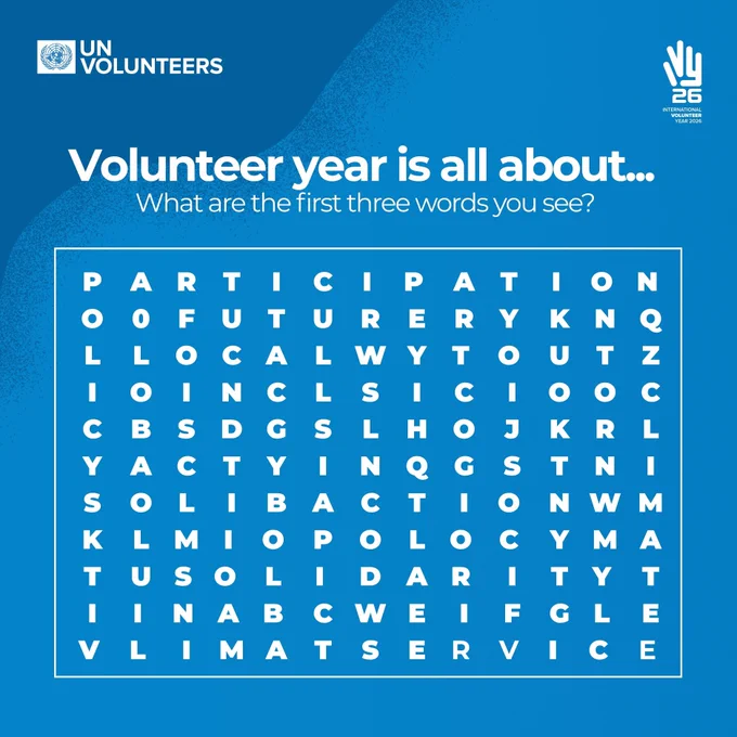 Blue UN Volunteers graphic featuring the UN Volunteers logo in the top left and the International Volunteer Year 2026 logo in the top right. Large white text reads, “Volunteer year is all about… What are the first three words you see?” Below, a word search puzzle contains volunteering-related words hidden among random letters.