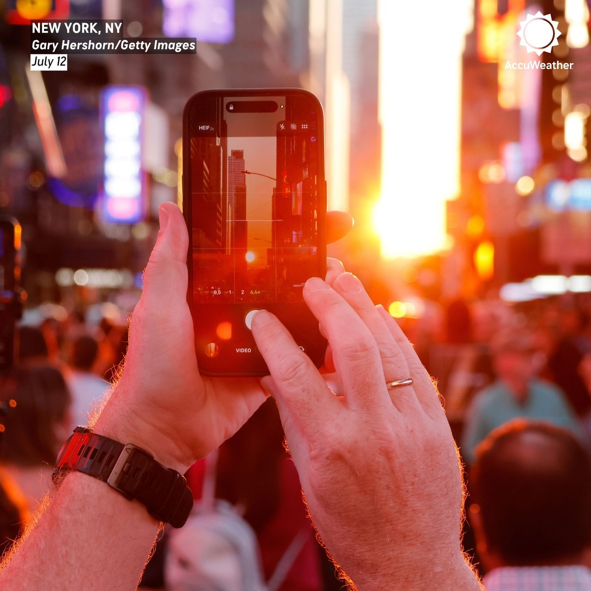 accuweather's tweet photo. New Yorkers gathered to photograph the final Manhattanhenge sunset of the year in New York City over the weekend. https://t.co/y2YVAE5s48