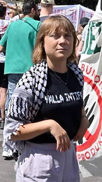 HenMazzig's tweet photo. Greta Thunberg sported a "Yalla Intifada" t-shirt at a protest.

For Jews and Israelis, the Intifadas were terrifying periods of senseless violence that left hundreds of civilians dead. 

To Greta, it's a fun novelty tee. https://t.co/3FPfxPNvMd