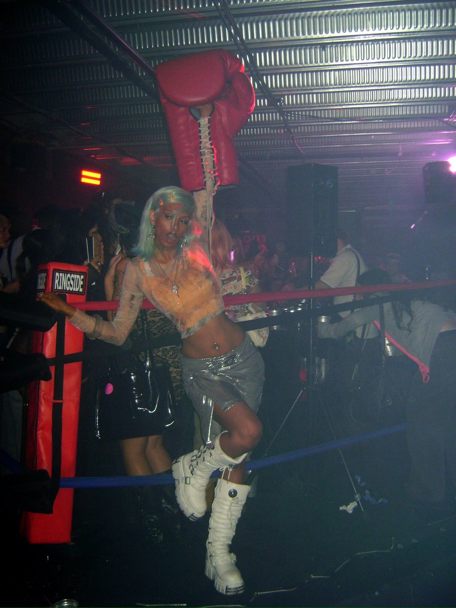 skyicidal's tweet photo. they had giant boxing gloves and a boxing ring in the club https://t.co/trWJJhExwO