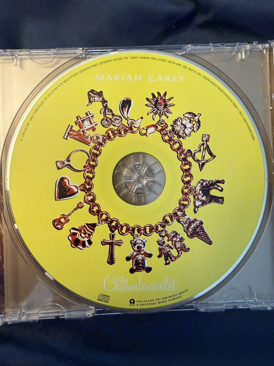 RyBread1992's tweet photo. Current US-issued copies of Mariah’s underrated classic Charmbracelet have a slightly redesigned disc art with a different color scheme! ☔️ 🐑 🌻 https://t.co/PAsi9Co1vp