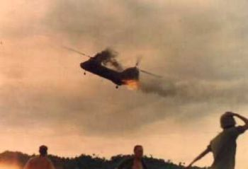 VoicesfromNam's tweet photo. CH-46 from HMM-265 trailing smoke and flame after being hit by PAVN anti-aircraft artillery. The helicopter crashed and exploded upon impact, killing 13 marines https://t.co/oJnJaYXrOL