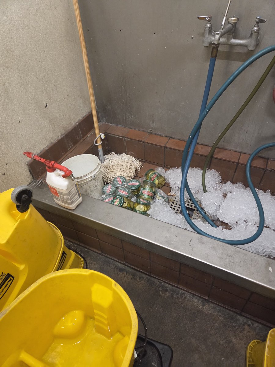 Aclowno's tweet photo. Who left 11 jars of pickes in the mop station https://t.co/NvOG300y6J