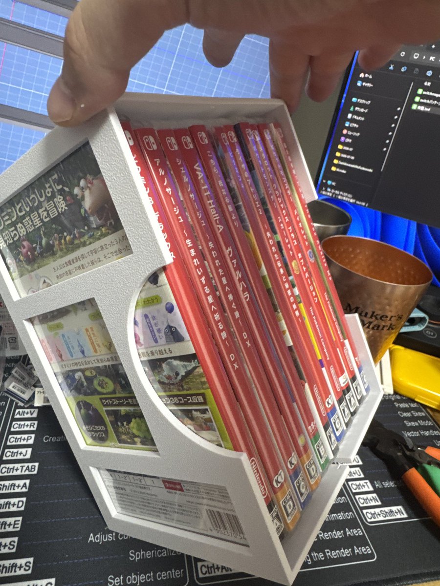 sin_hosaki's tweet photo. Switchのソフトパケコンテナいいぞこれ。
誤差想定して広めに作ったら１０本入れる想定だったのが１１本入ったお得仕様。
これで片付けが捗る!
#3Dプリンタ https://t.co/HbKy8Fl4zN