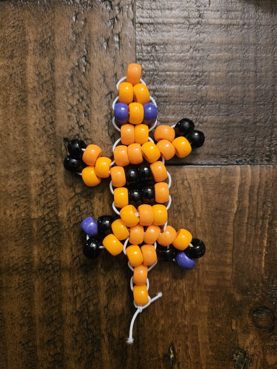 orinistv's tweet photo. Instead of cleaning her room like I have been asking for the last week, my middle child made bead lizards all day yesterday.  I, naturally,  got a Halloween themed one and it is amazing. https://t.co/es9iU1URNQ