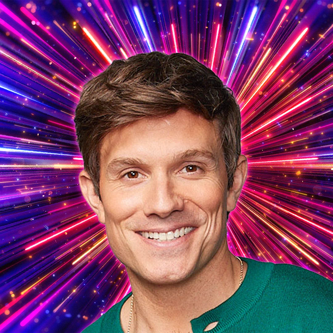Headshot of Will Best in front of branding for Strictly Come Dancing 2026 - a background of glittering pink, purple and gold beams of light. 
