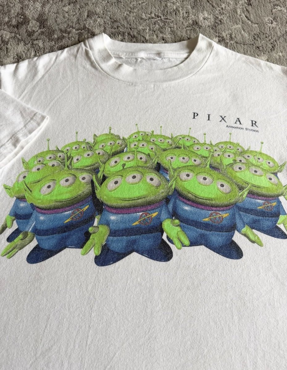 theattractmag's tweet photo. 90s pixar t-shirt https://t.co/FT22EHPm74