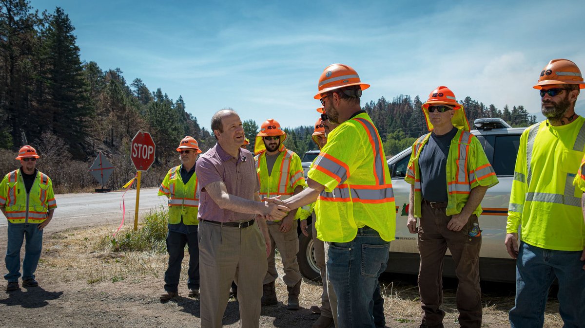 GovofCO's tweet photo. Thanks to the incredibly hard work of the men and women of @ColoradoDOT, a key bridge on Highway 165 was reopened to emergency responders less than 11 hours after it was burned down in the Aspen Acres Fires. The new temporary bridge opened up an important pathway for emergency services and evacuation from the area. It was great to be there today to thank the workers who made this possible.