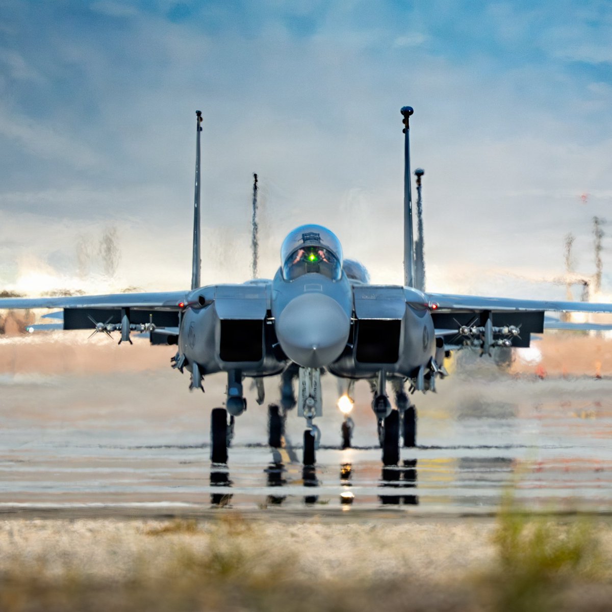 Boneyardsafari's tweet photo. Strike Eagles lined up for take off last week at Nellis AFB. Designed in the 1980s, it transformed the air-superiority F-15 Eagle into a formidable long-range interdictor capable of deep strikes into enemy territory while retaining its legendary dogfighting capabilities. #f15e https://t.co/Hm4iHlLt6l