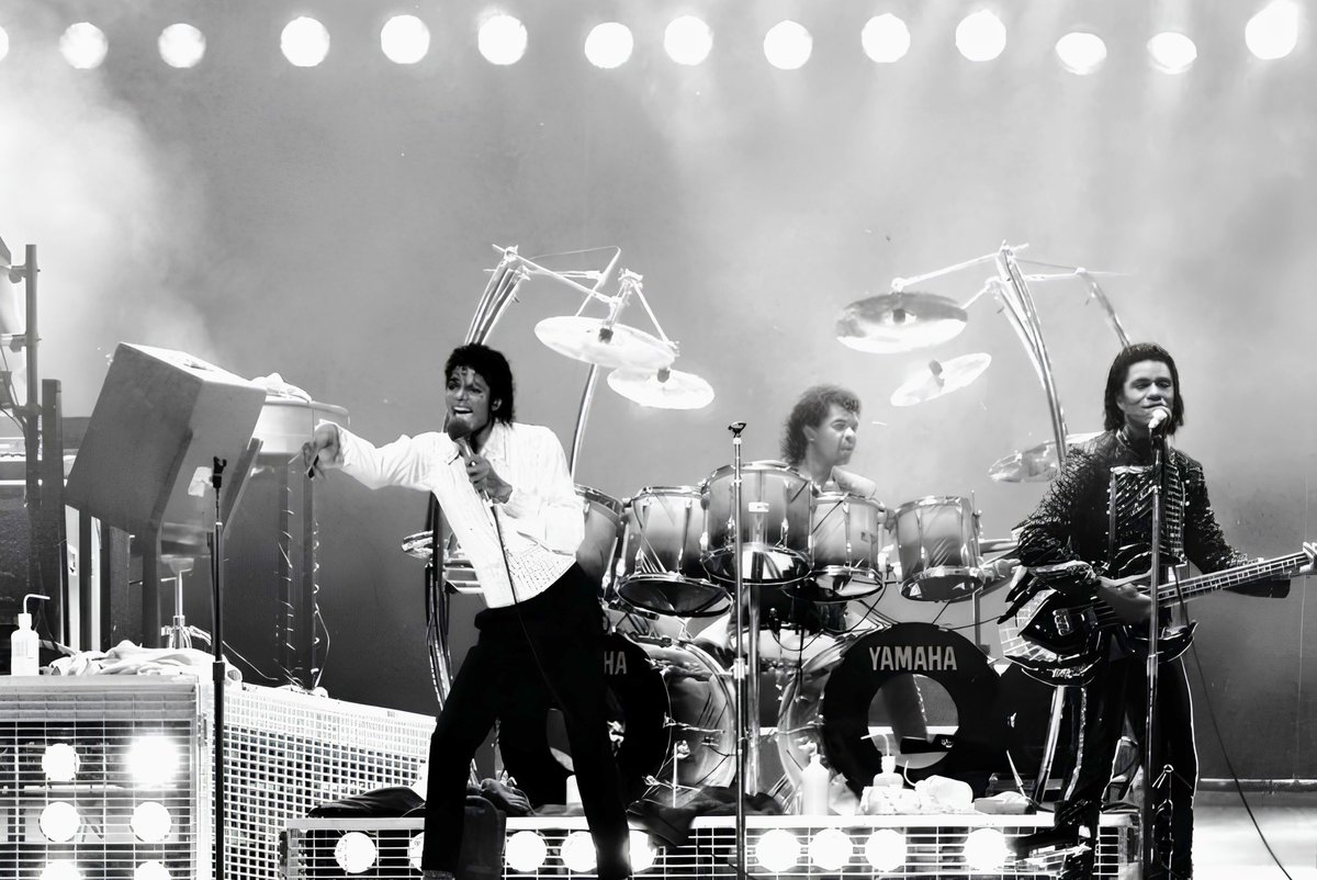 jsugarfootm's tweet photo. When I first joined Michael in 1979, I met a very shy, quiet and reserved young man. A musical genius, without question, but still discovering who he was becoming as an artist and as a man. I had the rare privilege of watching that transformation happen right in front of me. From the Destiny Tour, to Triumph, and then Victory, I watched Michael absorb everything around him like a sponge. He was curious. He noticed the smallest details. I remember him asking me about the curl I wore in my hair back then. I called it my Superman curl. He asked me why I wore it and even said, “You don’t think it’s girly?” I laughed and told him, “Superman wore it!” I thought it was cool. Michael never forgot the little things. Over the years, I watched his sound, his movement, his confidence and even his style evolve. By the time we reached the Victory Tour in 1984, the shy young man I met five years earlier had transformed into something the world had never witnessed before. People today may never fully comprehend the magnitude of Michael Jackson’s stardom during that period. There was no social media. No internet. No algorithm pushing his face into millions of homes. Michael became a global phenomenon on a scale that was almost impossible to comprehend, and I witnessed it from the best seat in the house…behind my drums. To watch my friend become the biggest star on Earth, right before my eyes, was nothing short of remarkable. I knew Michael before the world crowned him the King of Pop. I watched him become him. And that is something I will carry with me forever. #michaeljackson
