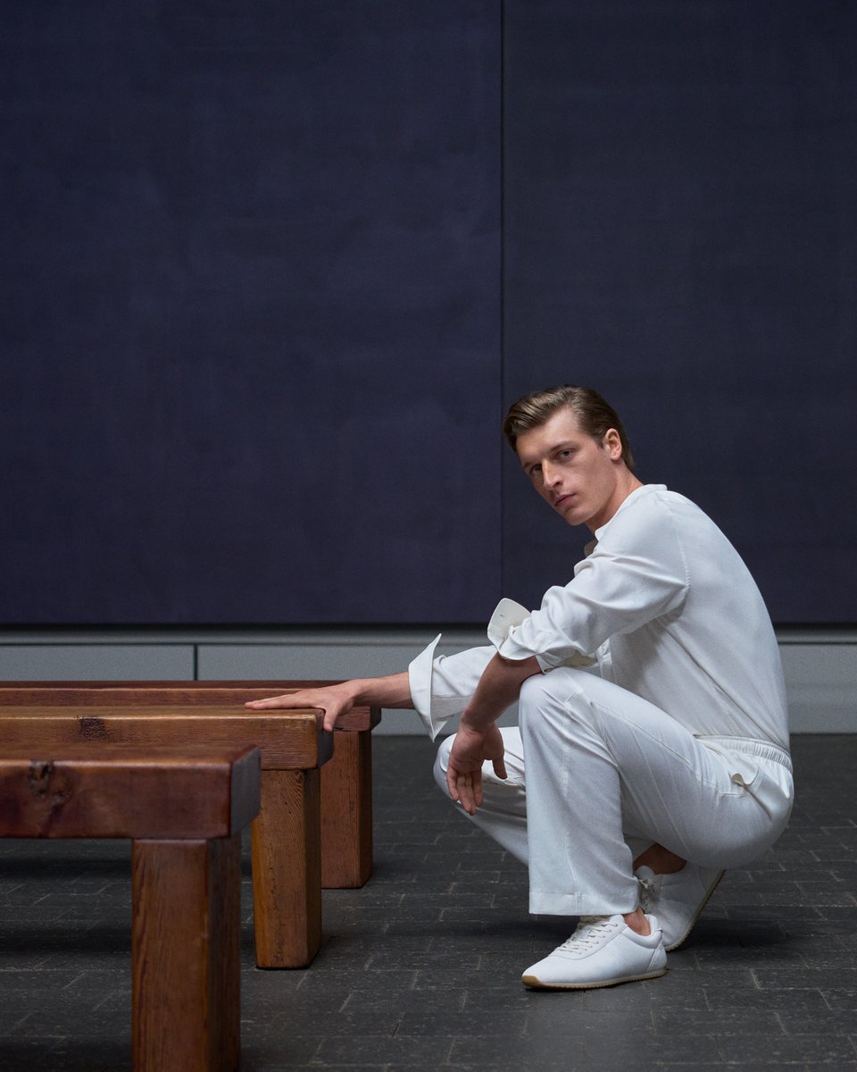 LoroPiana's tweet photo. A silhouette in light. 

In contrast with the depth of Rothko’s monochromes, the Fall/Winter 2026-2027 men’s look in white holds its ground without competing. At its base, the Fast Walk sneaker presents a refined take on everyday ease, combining exceptional cushioning with the clean line the silhouette demands. 

Colin shot by Mario Sorrenti at the Rothko Chapel, Houston, Texas.

#LoroPiana
#LoroPianaFW26