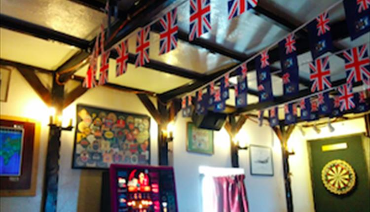 HeIsTheCuz's tweet photo. all the Falklands discourse is crazy when you remember it's basically a British village of 3500 people with 6 pubs/bars between them that all look like this inside

and they listen to the radio at lunchtime to find out what vegetables are back in stock at the shop https://t.co/9MqeXoFSyN