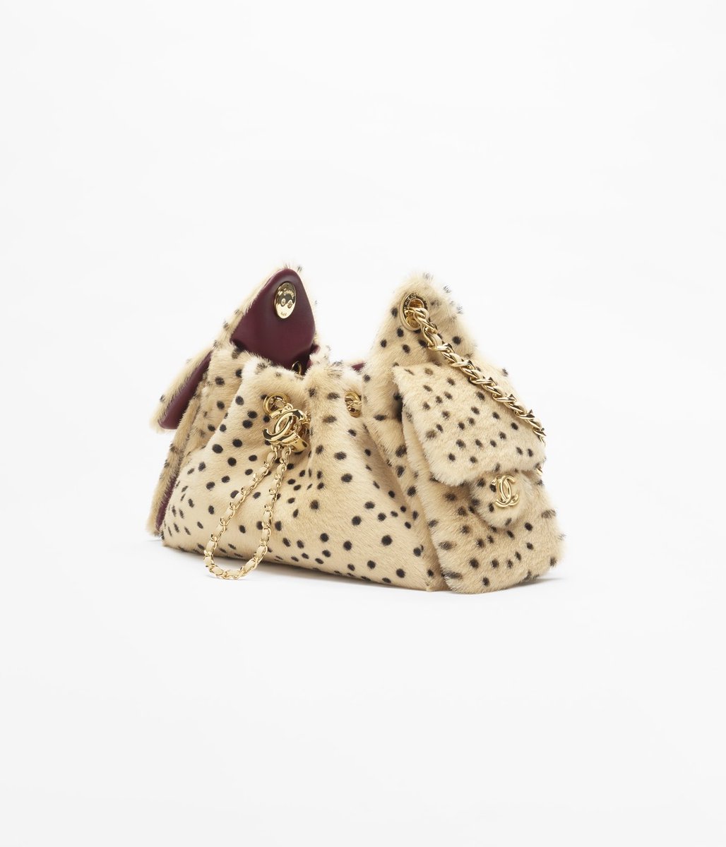 saintdemie's tweet photo. lana del rey just announced two albums by casually posting herself carrying one of chanel’s most wanted bags: the fw25 leopard chanel ‘25 🐆 https://t.co/8WGgLDtqu5