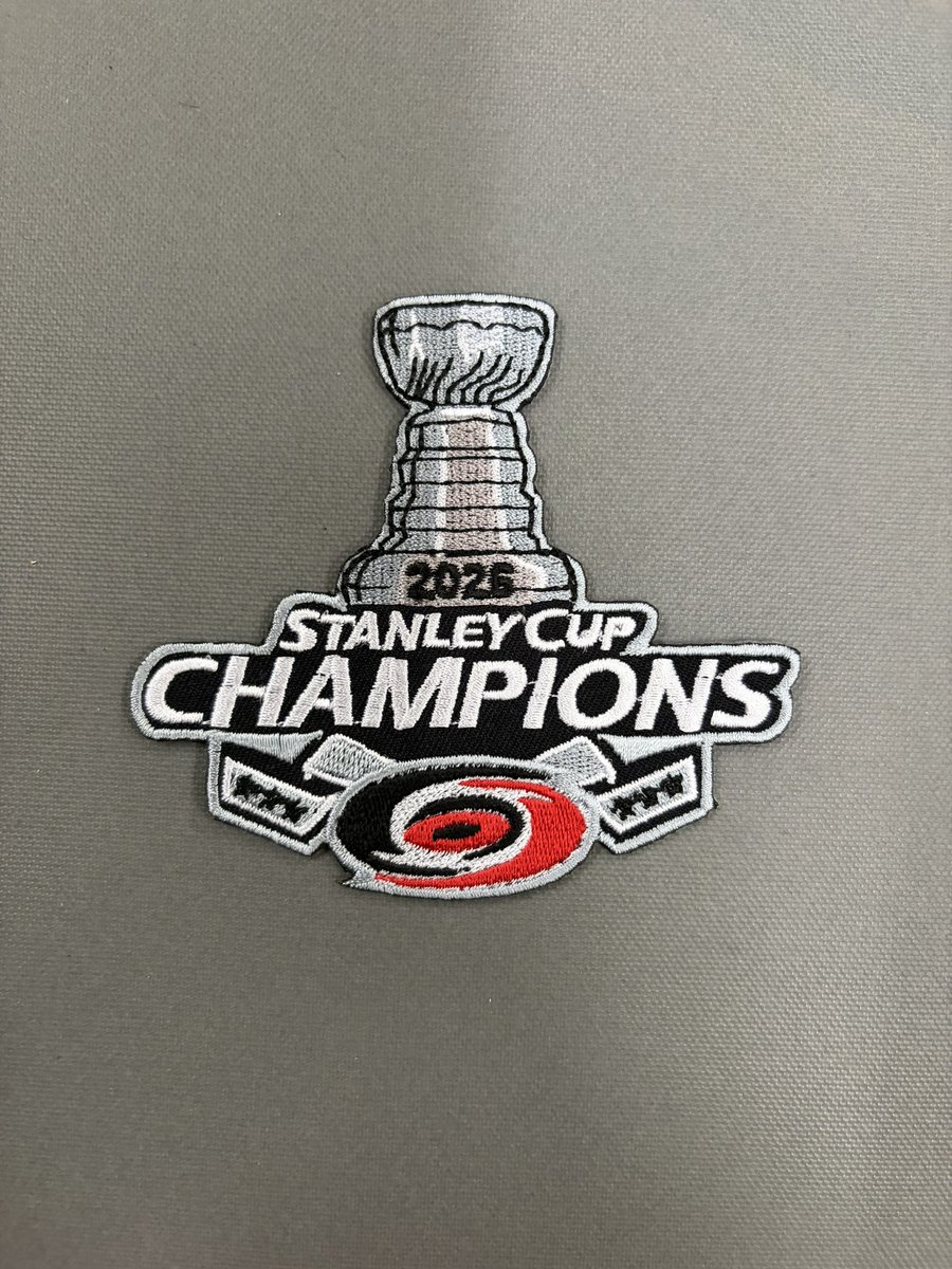 PrimoXHockey's tweet photo. 🏆 2026 Stanley Cup Champions patches are here! Multiple styles available while supplies last. Stop by the shop to get yours!

We can press them onto your jersey for an extra fee as well. 

#canes #stanleycupchampions #raleigh #hockey #jerseypatch https://t.co/nGcxFWiZKx