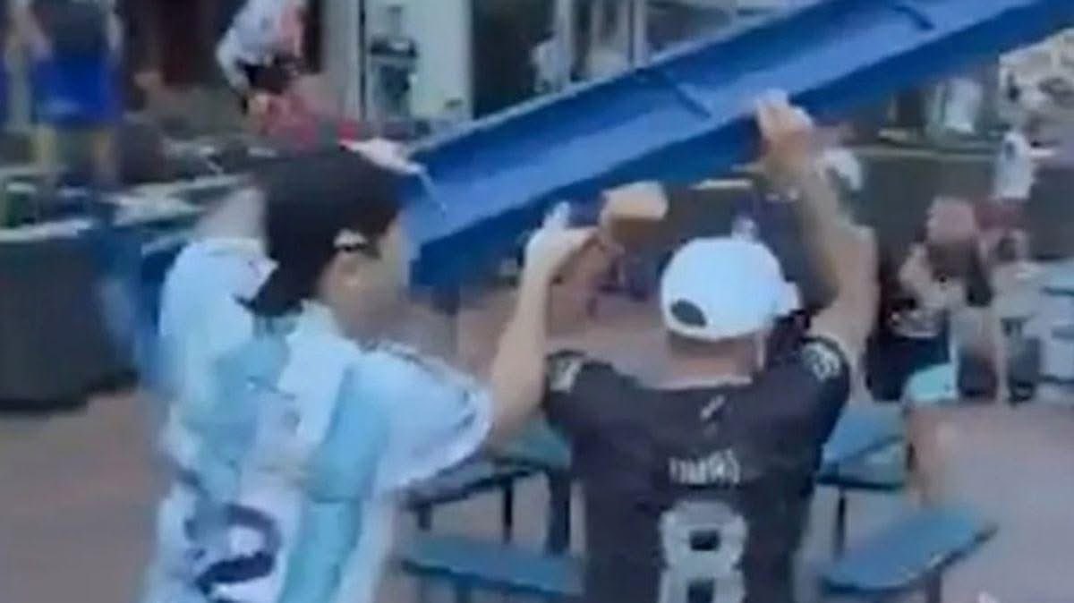 BICEUK's tweet photo. ‼️A huge fight broke out among Argentina fans ahead of the semi-final clash against England.

Footage shared on social media caught Argentinian supporters hurling glass bottles, benches, bins and even tables at each other in Atlanta, where there match will take place. 

The violence reportedly broke out between rival fans of the San Lorenzo and Huracan clubs. 

Police separated the two groups and at least one man was reportedly handcuffed by Atlanta cops and led away from the crowd.

The violence broke out at what is believed to have been a "flag-waving rally" before the match, but police were forced to intervene to quash the fights.

Around 10,000 Argentina supporters had descended on Downtown Atlanta for the flag-waving event - known as a "Banderazo" - before the row kicked off.

 Recent tensions between the two sets of club fans goes back to Russia in 2018, when violent scenes also erupted in Nizhny Novgorod and Saint Petersburg.

This comes as Atlanta Police confirmed it has "enhanced" policing for the World Cup semi-final clash.

The FBI has classed tonight's game as the "highest risk" match at this years tournament, after meeting with officials and local police.

🇬🇧 Website: https://t.co/m99CCSKXSi
🇬🇧 Linktree: https://t.co/8n8Ms0KhGa 
🇬🇧 Shop: https://t.co/JjhoGff48m