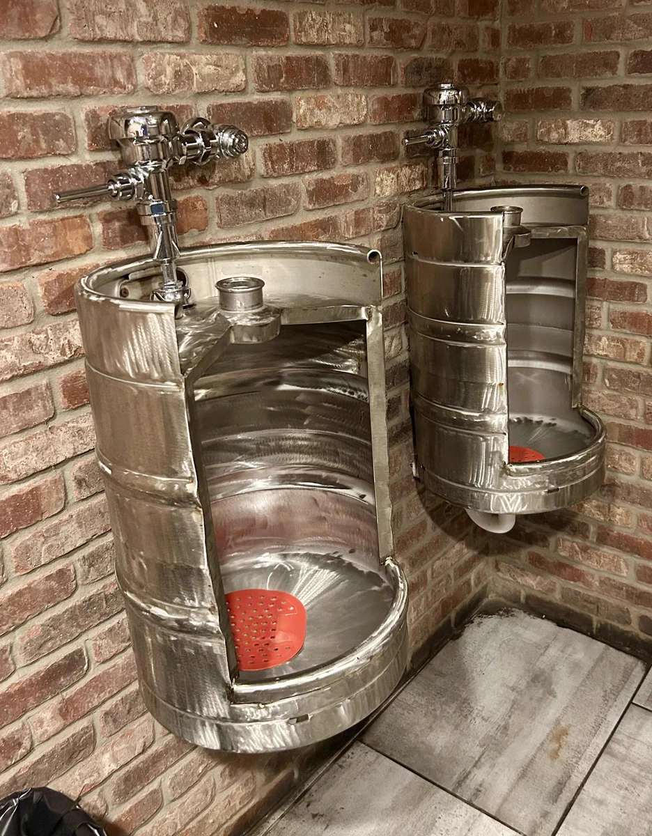 A beer barrel used as a urinal.