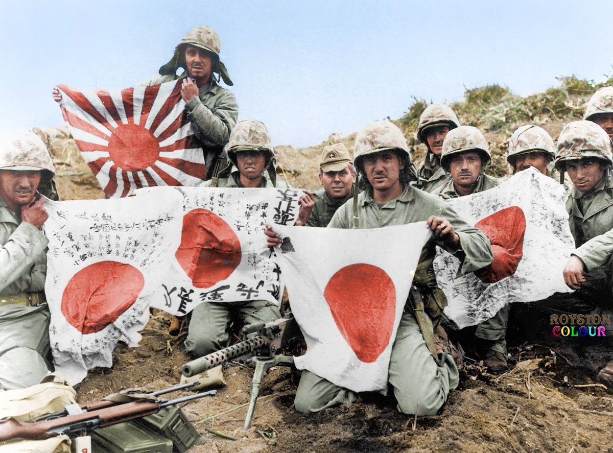 VoicesofWW2's tweet photo. February 25, 1945

USMC 5th Division Marines grouped behind their Browning M1919 .30 calibre machine gun, display Japanese battle flags captured during the first few days of the bloody fight for Iwo Jima.
It was the men of the Fifth who fought their way to the top of Mount Suribachi to raise the American flag on the rim of the crater.

The 5th Division landed on Iwo Jima on February 19, 1945, southeast of Mount Suribachi. The division sustained heavy initial losses, so much so that by that afternoon, the 26th Marine Regiment had to be released as the division reserve.

On February 23, two American flags were raised on Mount Suribachi by members of the 28th Marine Regiment. The 5th Division would fight on Iwo Jima from February 19 until March 26 where they would sustain 2,482 killed in action, 19 missing in action, and 6,218 wounded in action. This was the highest casualty rate among the three Marine divisions involved in the invasion.