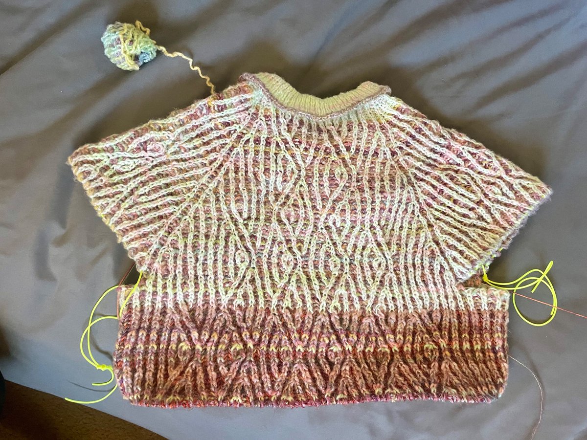 thpock's tweet photo. took a couple days off to re-knit a hat I lost but I'm back on my main project. to get the zigzags to expand all the way around to the front will make it too long, so I'm altering the design a bit. really like how the darker colors I added are coming out https://t.co/dwA2RVa7XL