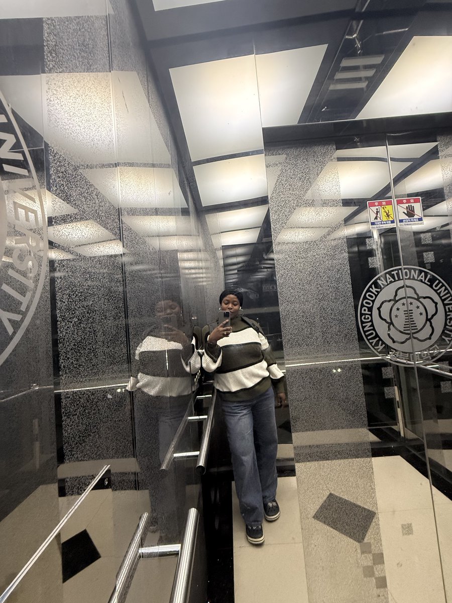 mus_toyy's tweet photo. Mirrors in elevators are not installed only so passengers can check their appearance. Their main purpose is practical: they help wheelchair users see behind them when entering, turning, or reversing out of a small elevator. 

Since there may not be enough room to turn a wheelchair around, the mirror provides a clear view of the doors and other passengers.They also make the elevator feel larger and brighter. Elevators are enclosed spaces, so mirrors can reduce feelings of claustrophobia by creating the illusion of more space. 

They also improve awareness because passengers can see more of the cabin without turning around, which may make the space feel safer. So although people naturally use elevator mirrors to fix their hair or check their clothes, their more important functions are accessibility, comfort, visibility, and safety. 

This is not unique to Korea, but it is especially noticeable here because mirrors are common in apartment, university, office, hospital, and subway elevators. So yes, one can still use them to fix scarf, but accessibility was already being considered before your elevator selfie.