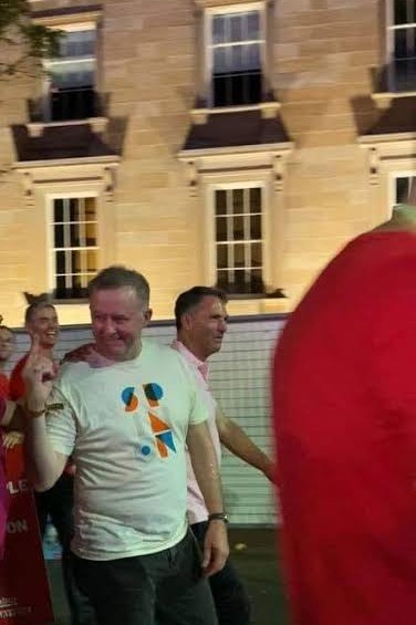 GuardianOfKarma's tweet photo. Here's hardly ever seen footage Anthony Albanese wants wiped off the internet &amp; has almost succeeded in doing so. 
In 2020 at a Mardi Gras march (of course) Anthony Albanese stuck his finger up at protesters. 
This is Albanese showing  his true colours, that being rainbow. https://t.co/yF9VklGTVb