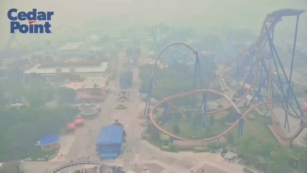 TylerSebreezy's tweet photo. I can't get over the view of @cedarpoint with the extensive amount of Canadian wildfire smoke in the air. https://t.co/apVIDvURvP