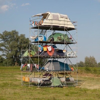 core77's tweet photo. This Highrise Campsite is by Dutch artist Willem de Haan. Built from construction scaffolding, camping gear and string lights, it's 11m (about 36') tall and hosts 12 tents, in… https://t.co/IWRY4PemcI #WillemDeHaan #HighriseCampsite #ArtInstallation #DutchArt #SustainableDesign https://t.co/x12meQ4afT