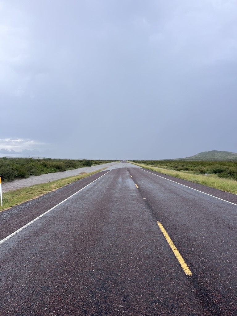 txdotelp's tweet photo. US 385 MM 518-528 south of Marathon, water on road. https://t.co/U503gMRSVT