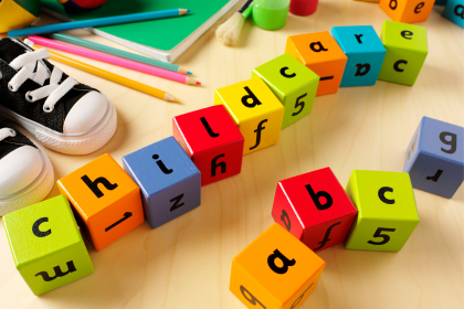 Toy blocks that spell the word childcare.