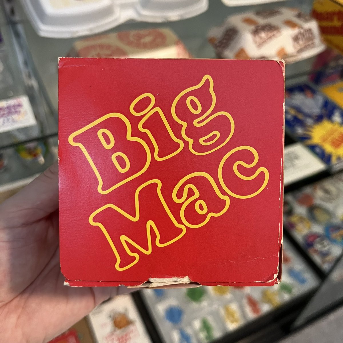 consumertc's tweet photo. Here is the first Big Mac box design from the early 70s. While the sandwich was first released in 1968, it was initially held together by a cardboard collar and wrapped in foil. https://t.co/hPuJMsJdM1
