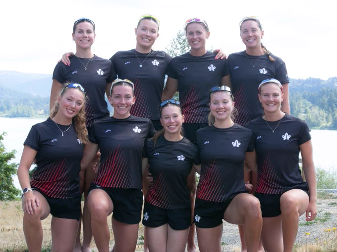 U23 Rowing Team Canada women's eight, featuring nine athletes standing and kneeling for a photo in their uniforms