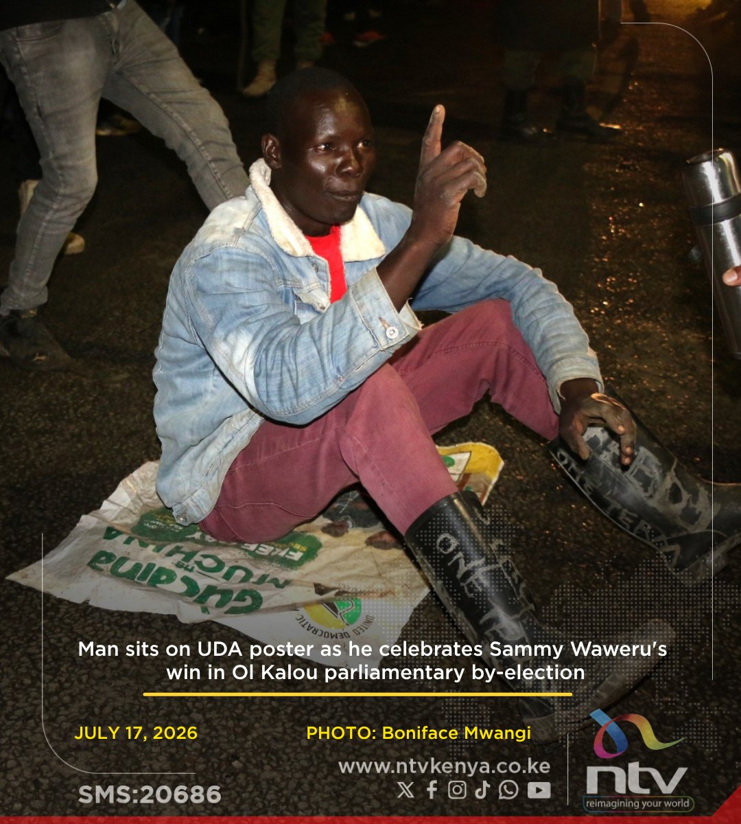 ntvkenya's tweet photo. Man sits on UDA poster as he celebrates Sammy Waweru's win in Ol Kalou parliamentary by-election https://t.co/065IIB517o