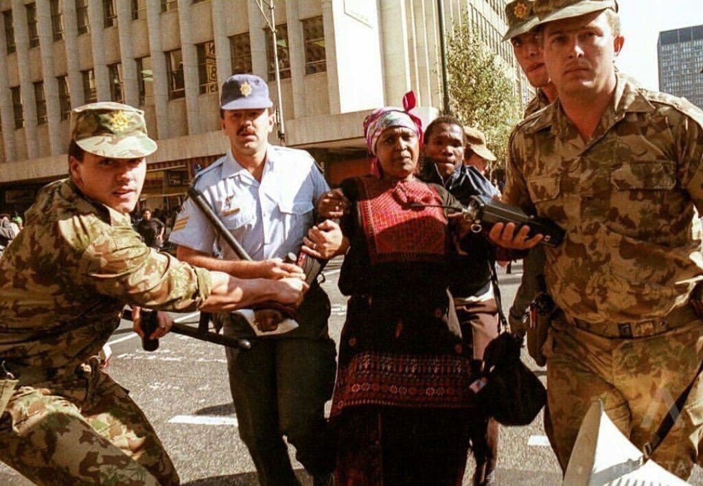HistorySAZAR's tweet photo. Winnie Mandela arrested  by South African police in downtown Johannesburg,  May 1991. Credit: Trevor Samson/AFP. https://t.co/ezr6ZJ6wvJ