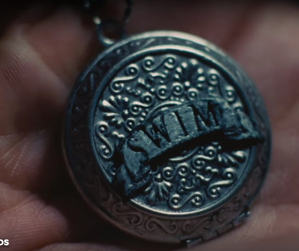 kthnoir7's tweet photo. One detail I can't stop thinking about is the locket.

There's one major difference between the locket: in SWIM, it's always closed, It opens one time to show the compass saying SWIM. In Normal, Taehyung opens it for there to be nothing inside it. 

But what if that's the point?

What if the locket was never meant to hold a photograph or an object? What if it's meant to hold a place?

Throughout literature and film, lockets and pocket watches are often used as objects that connect different realities, memories, or points in time. They're less about what's physically inside and more about what they allow the holder to access.

If that's the symbolism here, the empty locket could function almost like an escapism locket — an object that lets its owner leave reality behind and enter another emotional or psychological space. The "emptiness" isn't emptiness at all; it's a doorway.

It could even explain why SWIM keeps the locket closed. We weren't supposed to know what it did. Normal finally opens it , not to reveal an object, but to reveal that the real significance was never inside the locket itself. The act of opening it is what matters.

Whether it's a portal to memory, a form of escapism, or even a symbolic time machine, the locket seems less like jewelry and more like a key. The mystery isn't what it contains, it's where it takes you.