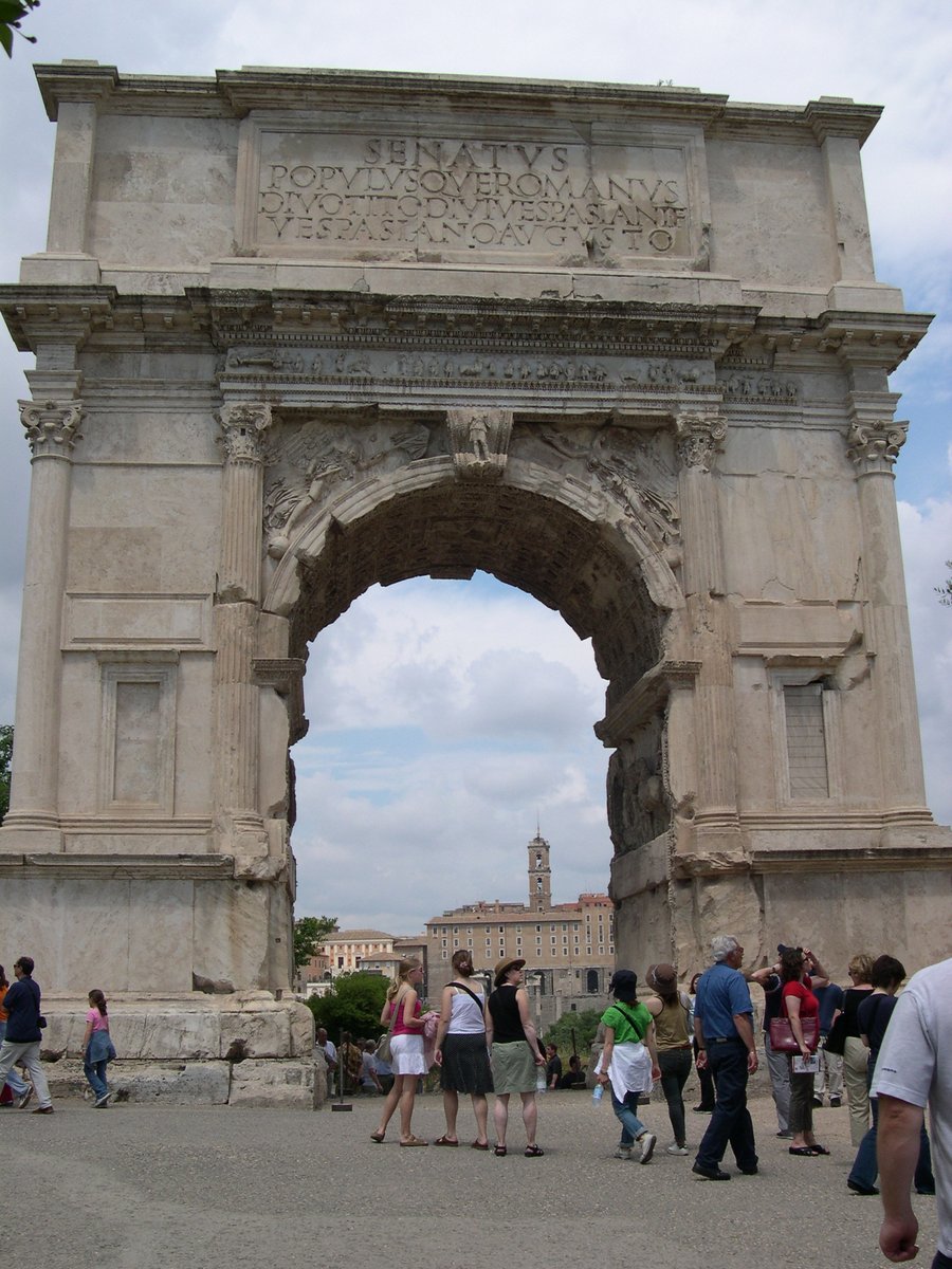 mdveachmap2022's tweet photo. Behind the Mystery:

One of my favorite scenes in The Trumpet's Call takes place beneath the Arch of Titus in Rome. As Mazetti and Claudia search the ancient monument for clues, they're unexpectedly "adopted" by an inquisitive little black kitten who decides to join the investigation.

Every time I visit the Arch of Titus, I can't help but picture that scene unfolding. And when I get home, my own black cat, Olive, reminds me that perhaps fictional kittens aren't so fictional after all. Anyone who shares a home with a black cat knows exactly how that happens—you don't choose the cat. The cat chooses you. Mine certainly did.

It's moments like these—standing in places where history was made and then bringing a little piece of real life into the story—that make writing this series so much fun. 🐈‍⬛
