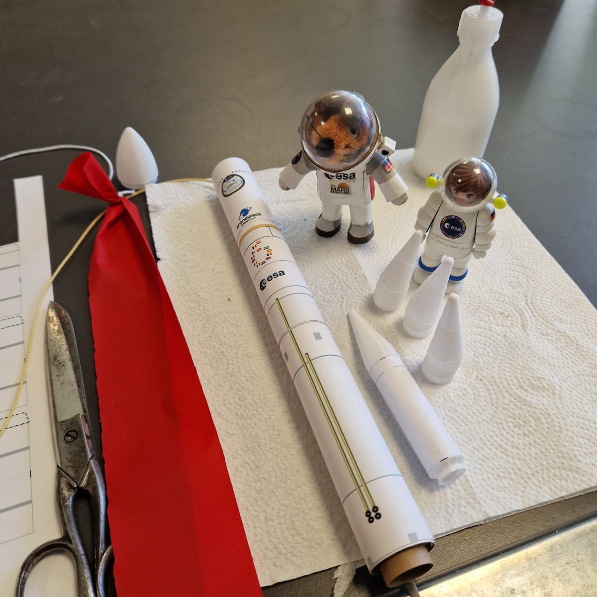 MiniAstroAmelie's tweet photo. @Mausonaut ... and we will have #Ariane6 models for the kids at #ESASpaceCamp 2026 as well! And another #rocketry exercise is prepared, too! 
But now it's time to ship all the equipment to #ESOC! 
#STEAM #STEMEd #ESA https://t.co/W7rK00cE36