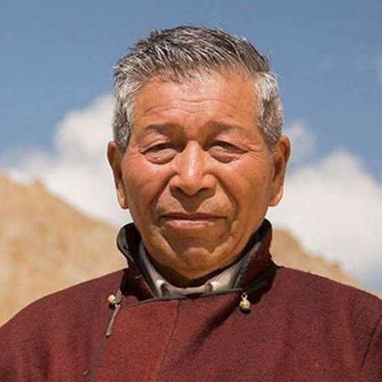 BS_Prasad's tweet photo. He is Padma Shri Chewang Norphel, the great son of Ladakh and Ice Man of India, 

The PR machinery manufactured a messiah out of Sonam Wangchuk. Meanwhile, Chewang Norphel, the engineer who pioneered Ladakh's artificial glacier technology and helped tackle its seasonal water crisis, barely gets a mention.

He quietly built over 300 irrigation canals, helped bring water to around 20,000 acres of land, and pioneered the construction of artificial glaciers. 

His entire life has been dedicated to public welfare without any self-promotion, without caring about the limelight or getting involved in controversies and unnecessary political issues.

Throughout his lifetime, Norphel has built over 15 artificial glaciers and constructed hundreds of canals, bridges, and irrigation systems across Ladakh, transforming the region's agricultural viability.  

2010: Received the prestigious Jamnalal Bajaj Award for Application of Science and Technology for Rural Development.  

2011: Recognized by the United Nations Development Programme (UNDP) for his achievements.  
2015: Awarded the Padma Shri by the President of India.

"White Knight": A documentary film of the same name was made to showcase his extraordinary journey and ecological contributions.