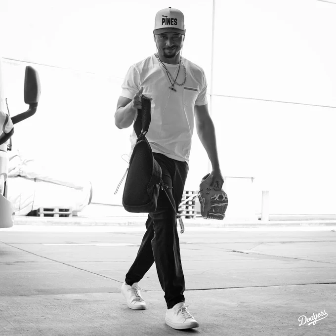 A photo of Mookie Betts pointing to the camera and smirking.