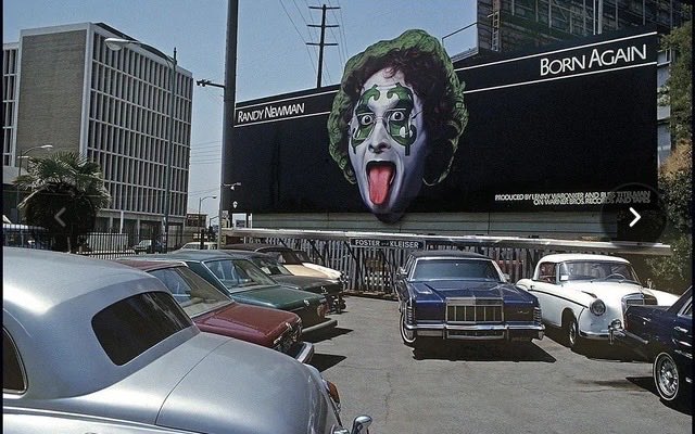 genesimmons's tweet photo. Randy Newman, that really talented writer-singer, who wrote hits like SHORT PEOPLE, I LOVE LA and many more, had a mid 1970s album that may remind you of someone. This billboard is on Sunset Boulevard in Los Angeles. https://t.co/jHcl2k475f