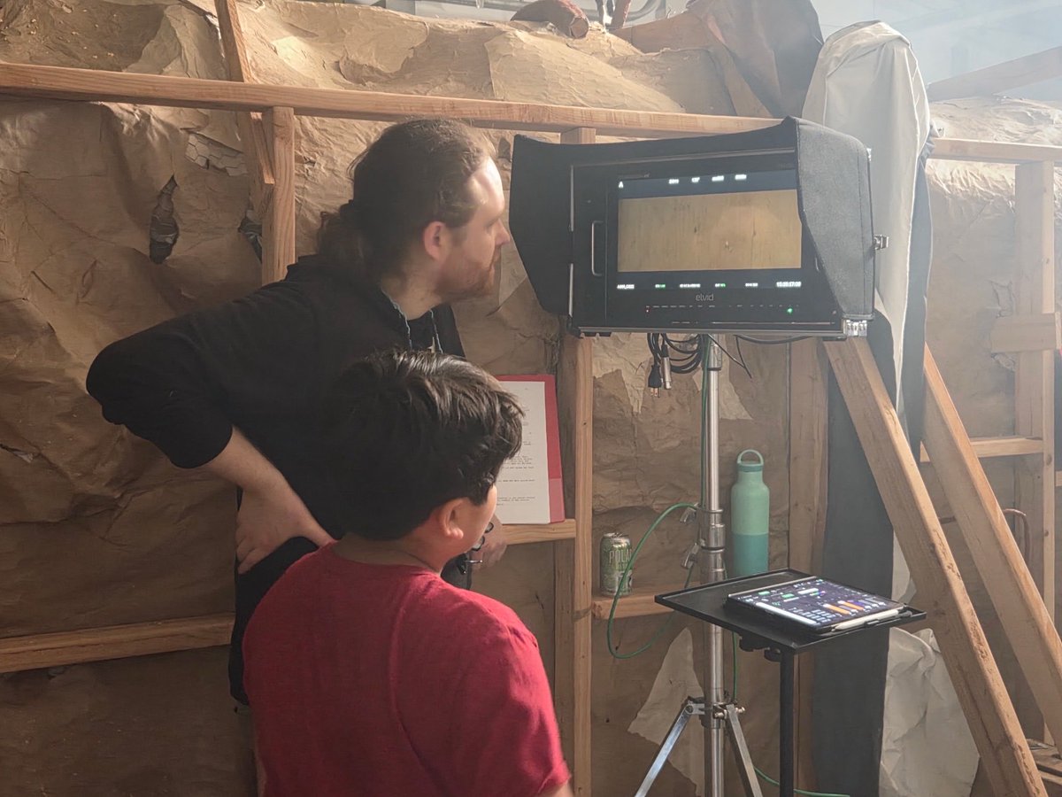 MoonoftheWitch's tweet photo. Writer and co-director Jason Hooper shows Puck actor, Jameson (who happens to be his nephew!) what it’s like behind the camera. #indiefilm #moviemaking #horror #indiehorror #moonofthewitches https://t.co/BUok9EeLMP