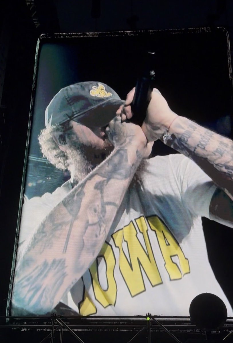 HawkGuyEnjoyer's tweet photo. Post Malone wore Iowa apparel with “Let’s Go Hawks!” chants deafening jack trice stadium the entire show. 

I was crying laughing the entire time. There’s no coming back from this, Iowa State. 😂 https://t.co/PKnj33PU92