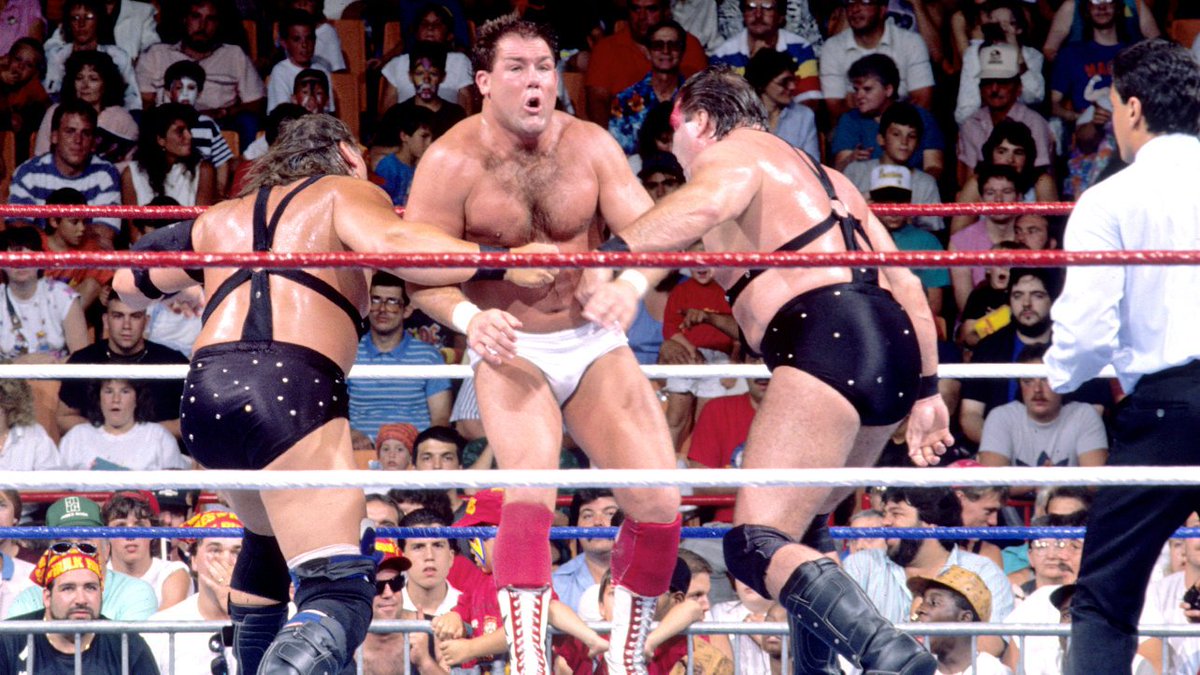 WWFWrestling1's tweet photo. On this day in 1989: Bobby Heenan's Brain Busters defeated Demolition to claim the WWF tag team titles! #WWF #WWE #Demolition #BobbyHeenan #AndretheGiant #TullyBlanchard #ArnAnderson https://t.co/9zBbvjZQfo