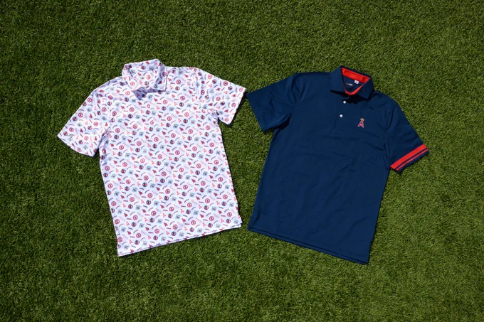 Two throwback Angels polos rest on turf at Angel Stadium.