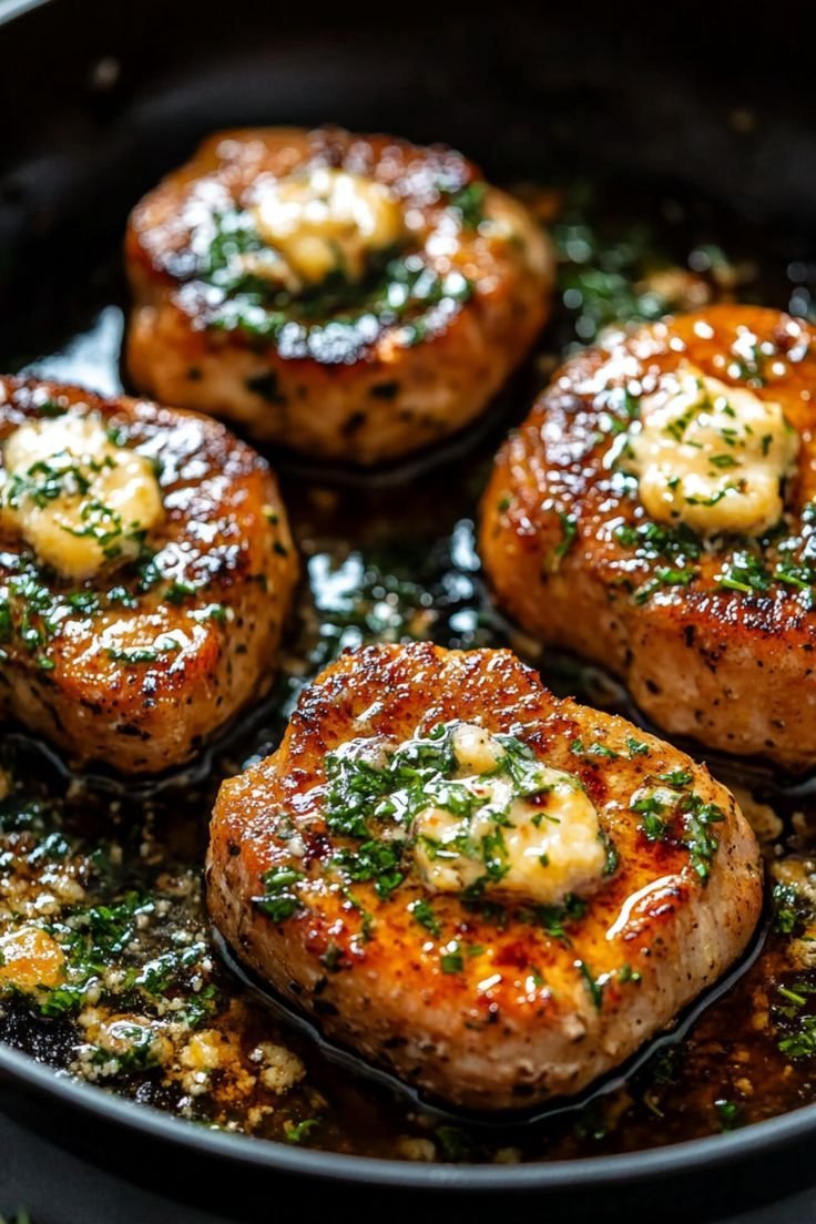 ann_ann886's tweet photo. Garlic Butter Pan‑Seared Pork Chops

Servings: 4 Prep: 10 minutes Cook: 10–14 minutes (plus rest)

Ingredients
4 boneless pork chops, 1 to 1¼ inches thick (about 8–10 oz each)
1½ tsp kosher salt
1 tsp black pepper
1 tsp garlic powder
½ tsp smoked paprika (optional, for color)
1–2 tbsp neutral oil (canola/avocado)
3 tbsp unsalted butter
4 garlic cloves, lightly smashed (leave whole so they don’t burn)
2–3 sprigs fresh thyme or rosemary
1 tbsp chopped parsley (finish)
Lemon wedges (optional)

Instructions
Season
Pat chops very dry. Mix salt, pepper, garlic powder, and paprika; season both sides (and edges).
Sear
Heat a heavy skillet (cast iron ideal) over medium‑high until hot. Add oil; when it shimmers, lay in chops without crowding.
Sear 2–3 minutes until a deep golden crust forms. Flip.
Butter baste
Drop heat to medium. Add butter, smashed garlic, and herb sprigs to the pan.
As butter foams, tilt the skillet and spoon the garlicky butter over the chops continuously for 1–2 minutes. This builds flavor and finishes the cook.
Doneness
Cook until the thickest part hits 140–145°F (60–63°C) with an instant‑read thermometer, about 3–5 minutes after the flip depending on thickness. If your chops are very thick, lower heat to medium‑low and give them another minute per side, basting as you go.
Rest and serve
Move chops to a warm plate, spoon some butter/garlic over, and rest 5 minutes (carryover brings them to a juicy 145°F).
Sprinkle parsley and serve with pan butter and optional lemon squeeze.
Pan sauce (optional, 2 minutes)
After removing chops, keep garlic/herbs in the skillet. Add ¼ cup chicken stock and 1 tsp Dijon; simmer 60–90 seconds, scraping up browned bits. Whisk in 1 tbsp cold butter off heat; salt/pepper to taste. Spoon over chops.

Tips
Thick chops stay juicier; thin chops overcook fast — reduce sear time if using ¾-inch cuts.
Don’t overcrowd; sear in batches for real browning.
If the garlic starts to darken, slide it to a cooler spot in the pan.
Great sides: mashed or roasted potatoes, green beans, asparagus, or a crisp salad.

Variation ideas
Honey‑garlic: whisk 1 tbsp honey into the finishing butter.
Mustard‑herb: rub chops with 1 tsp Dijon before seasoning.
Smoky: swap paprika for chipotle powder and finish with lime.