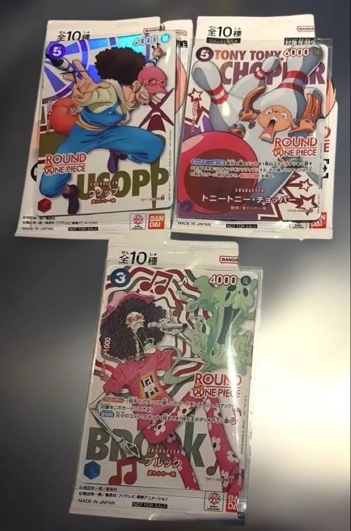 In-person shots of some of the Japanese OPTCG Round1 Promo Cards