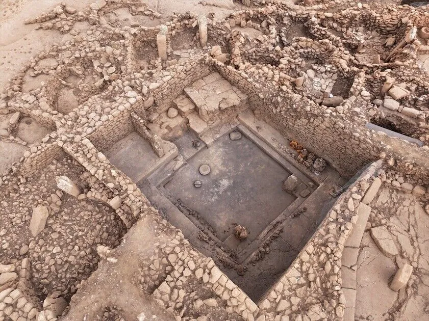 HistContent's tweet photo. Digging has resumed at the site that keeps rewriting the beginning of civilization.

Karahantepe in Türkiye, sister site of Göbeklitepe, has opened its seventh excavation season. The target this year is a mysterious rectangular hall, roughly 9 by 7 meters, its walls still standing 3.5 meters high with original plaster intact after 11,000 years.

Inside, benches carved from bedrock, four pillars, and the strangest feature of all, a stone bowl built into the north wall with a channel to carry liquid. A room plumbed for ritual, a hundred centuries before Rome.

The dig runs to October, then a protective roof seals the building for good. Whatever is in there comes out this season.
