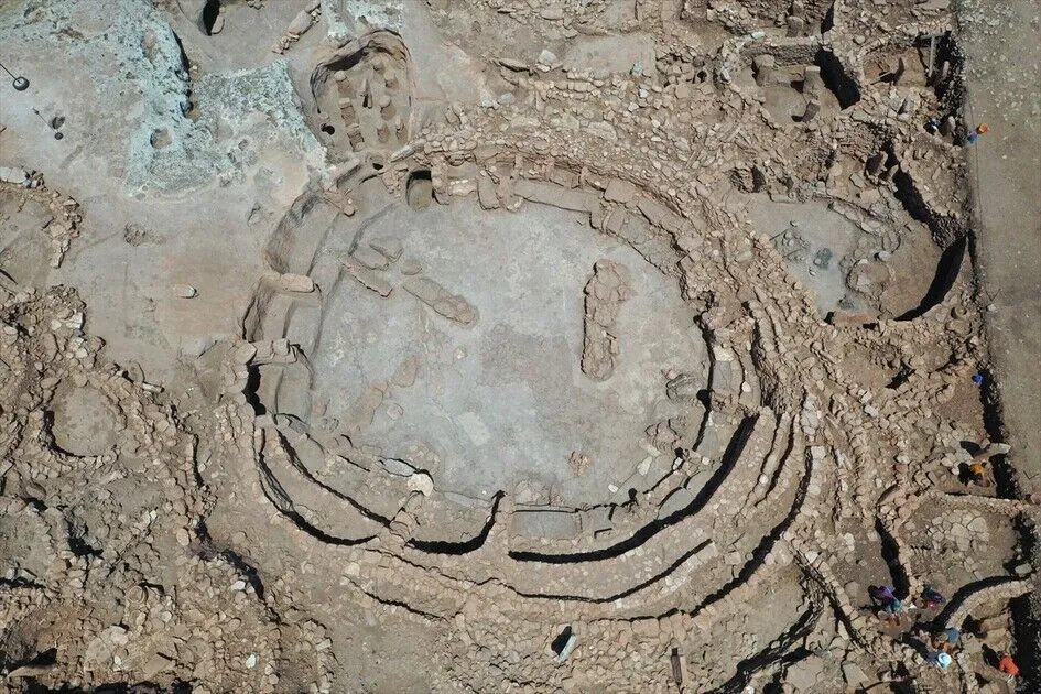 HistContent's tweet photo. Digging has resumed at the site that keeps rewriting the beginning of civilization.

Karahantepe in Türkiye, sister site of Göbeklitepe, has opened its seventh excavation season. The target this year is a mysterious rectangular hall, roughly 9 by 7 meters, its walls still standing 3.5 meters high with original plaster intact after 11,000 years.

Inside, benches carved from bedrock, four pillars, and the strangest feature of all, a stone bowl built into the north wall with a channel to carry liquid. A room plumbed for ritual, a hundred centuries before Rome.

The dig runs to October, then a protective roof seals the building for good. Whatever is in there comes out this season.