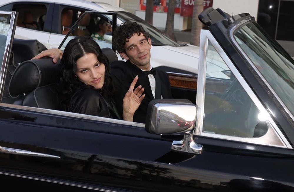 the1975__news's tweet photo. Matty and Gabby before their wedding. https://t.co/72Ya7uFr5E